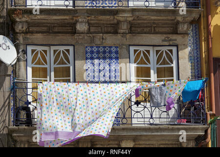 Clothesline with laundry in the wind on the balcony in Porto Portugal Stock Photo
