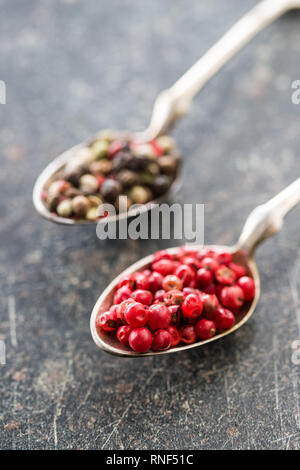 Dried pink peppercorn in spoon. Stock Photo
