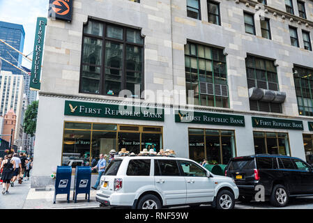 New York City, USA - July 27, 2018: Facade of a bank branch of First Republic Bank on the street with people around in Manhattan, New York City, USA Stock Photo