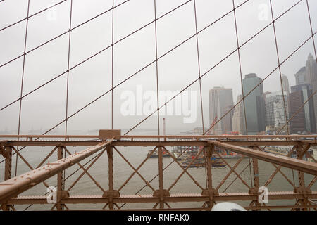 NEW YORK - CIRCA MARCH, 2016: view from the pedestrian walkway of the Brooklyn Bridge. The Brooklyn Bridge is connects the boroughs of Manhattan and B Stock Photo