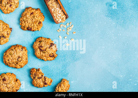 Homemade oatmeal cookies with cranberries and pumpkin seeds, top view. Stock Photo