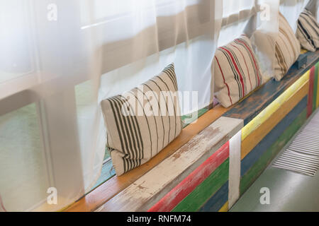 Patio Lounge area in a modern office. Loft style.The waiting area with lounge in entertainment center.wooden sofas near glass window at relax corner Stock Photo