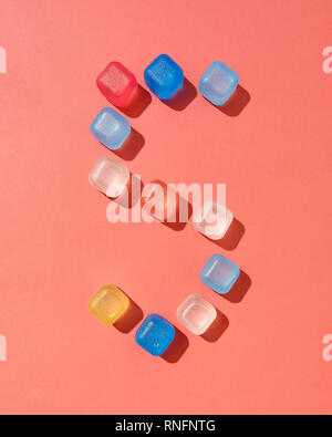 Figure five pattern from colored plastic ice cubes on a background in a color of the year 2019 Living Coral Pantone, copy space. Flat lay Stock Photo