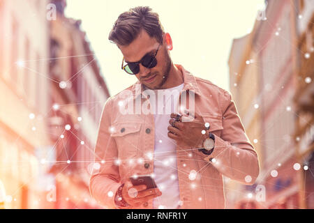 Abstract 5G Digital Network Concept with Young Adult Man Surfing on Internet on Smartphone Stock Photo