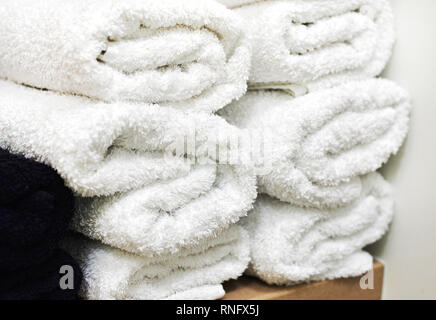 rolls of rolled towels are stacked. spa complex. Stock Photo