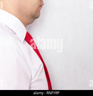 Male businessman in white shirt and double chin tie on a white background, obesity, close-up, copy space, background Stock Photo