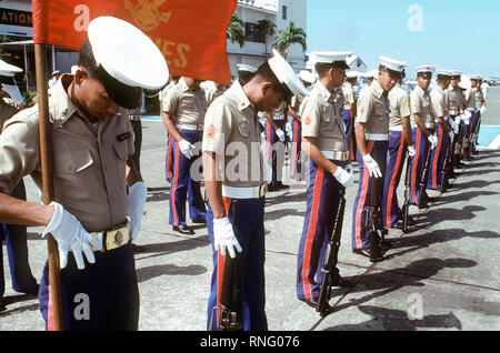 1982 - A Marine Corps honor guard waits for Secretary of Defense Caspar W. Weinberger to arrive at Arthur W. Radford Field for a visit. Stock Photo