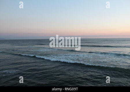 Ocean waves at sunset. Stock Photo