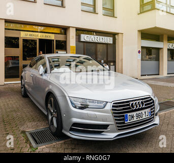 Strasbourg, France - Oct 1, 2017: Silver luxury Audi A8 vehicle parked in an upper-class neighbourhood near the entrance of the aprtment building Stock Photo