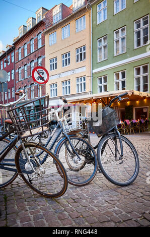 Copenhagen, Denmark - October 22, 2018: Bikes parked on a street in Indre By, also known as Downtown Copenhagen. Stock Photo