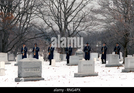 The Air Force Honor Guard fires a 21-gun salute at the conclusion of the graveside funeral service at Arlington National Cemetery. Stock Photo