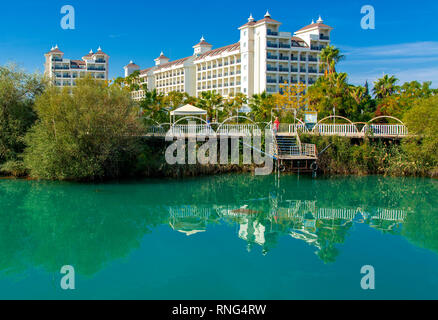 Alanya, Turkey - October 05, 2018. Beautiful hotels of Turkey against the background of distant mountains and blue sky. Photos of coast from the sea.  Stock Photo