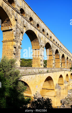 Close view of Aqueduct Pont du Gard in southern France. It is the highest of all elevated Roman aqueducts. Stock Photo