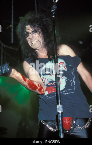 Singer and songwriter Alice Cooper (born Vincent Damon Furnier) is shown on stage during a 'live' concert performance. Stock Photo