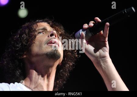 Rock musician best known as the lead singer and songwriter for rock bands Soundgarden and Audioslave, Chris Cornell, is shown performing on stage during a 'live' concert appearance. Stock Photo