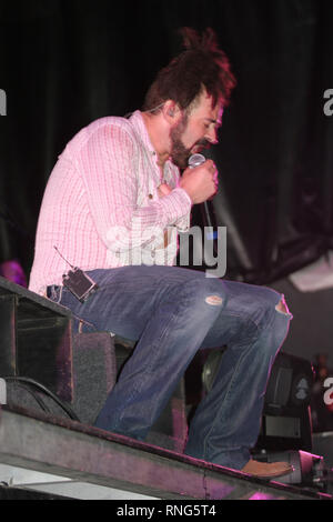 Singer Adam Duritz of the Counting Crows is shown performing on stage during a 'live' concert appearance. Stock Photo