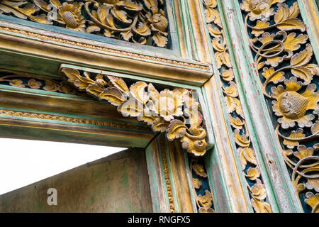 Traditional local balinese ornaments carved in wood by local craftmen by hands. Local traditions and craftmanship concept Stock Photo