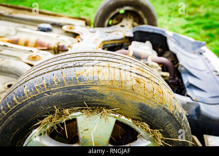 Car Crash and Car Damage. Vehicle in a field after high speed crash. Stock Photo