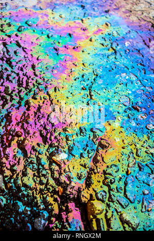Gasoline Petrol Oil Spill Rainbow on Tarmac Road Stock Photo