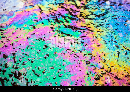 Gasoline Petrol Oil Spill Rainbow on Tarmac Road Stock Photo