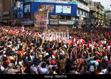 PUNE, MAHARASHTRA, September 2018, People, crowd cheering Dhol tasha pathak performance by raising hands during Ganpati Festival Stock Photo