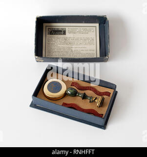 Old stamp seal for sealing and ink. Letter M. Of bronze and stone. Brand Aladine, Paris. In its original box, with two sealing bars and ink sponge Stock Photo