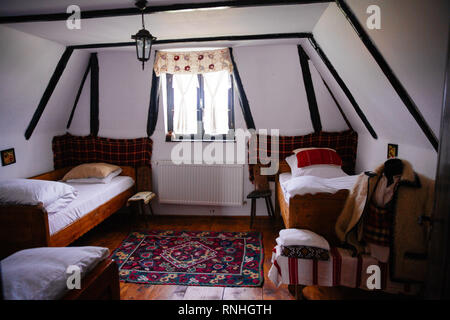 In the small village of Breb, Maramureș region of northern Transylvania are a group of 100 year old restored barns that are for rent Stock Photo