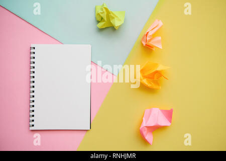 Blank notepad with place for text on a multi-colored background. Stock Photo