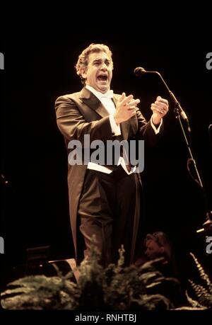 Spanish-Mexican operatic tenor Plácido Domingo is shown singing during a concert performance. Stock Photo