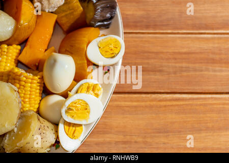 Steamed food. Typical food of South America called puchero arranged on a rustic table. Horizontal view Stock Photo