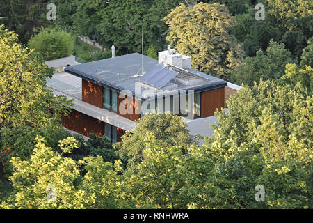 Solar Eco House Hidden in Woods Stock Photo