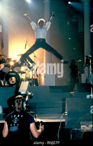 Duran Duran guitarist Warren Cuccurullo is shown performing on stage ...