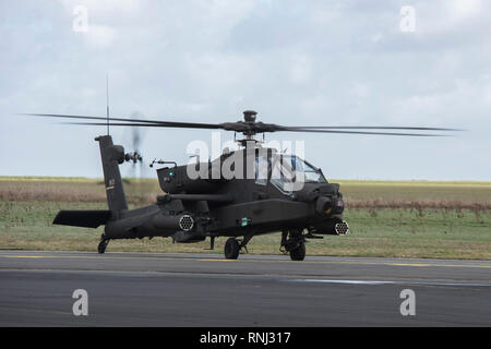 A U.S. Army AH-64 Apache from the 1st Air Cavalry Brigade, 1st Cavalry Division, departs from Chièvres Air Base, Belgium, Feb. 7, 2019. Chièvres Air Base served as an intermediate staging area before the 1st Combat Aviation Brigade deployed to Germany, Poland, Latvia and Romania for nine months to train with NATO partners in support of Atlantic Resolve. (U.S. Army photo by Visual Information Specialist Pascal Demeuldre) Stock Photo