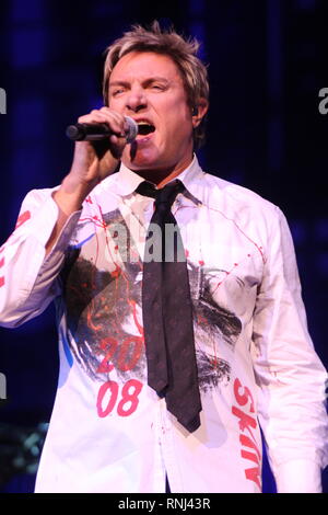 Duran Duran singer Simon LeBon is shown performing on stage during a 'live' concert appearance Stock Photo