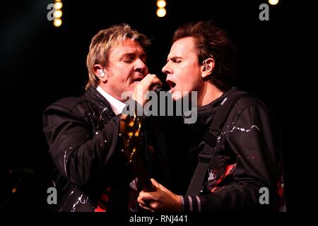 Duran Duran band mates Simon Lebon and John Taylor are shown performing on stage during a 'live' concert appearance. Stock Photo