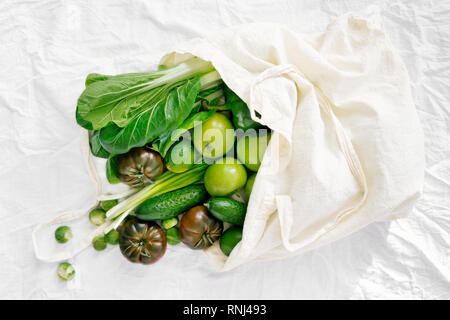 Fresh Organic Food Coming Out From Fabric Eco Shopping Bag, Top View, Flat Lay Stock Photo