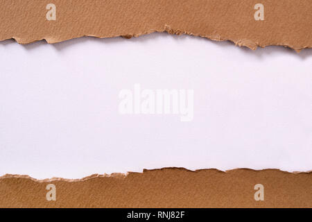 Torn brown paper center strip white background Stock Photo