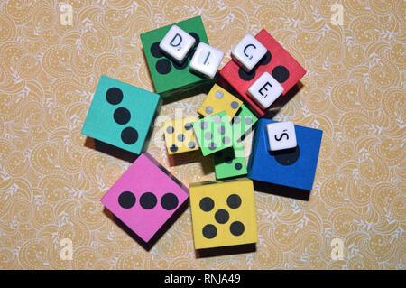 Dices and letters on the table.Rolling the dice concept for business risk chance good luck or gambling..... Stock Photo