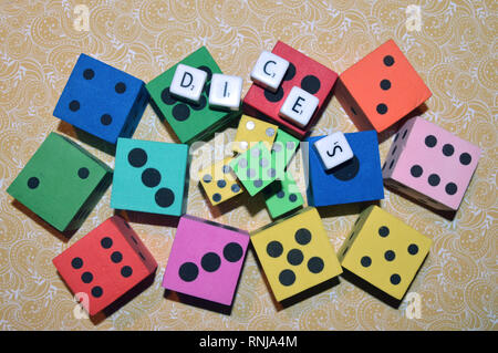 Dices and letters on the table.Rolling the dice concept for business risk chance good luck or gambling..... Stock Photo