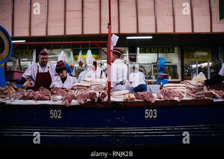 A local meat vendor in Green Bazaar, Almaty, Kazakhstan Stock Photo