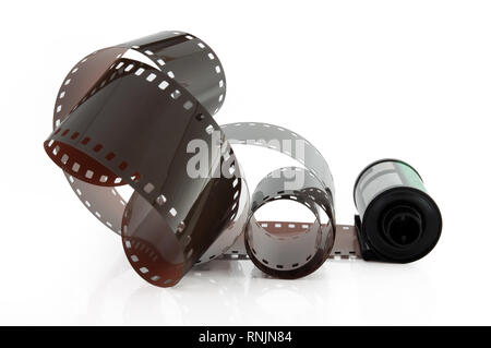 Old photographic 35 mm film with roll. Isolated on white background. Stock Photo