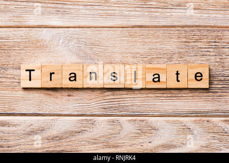 Translate word written on wood block. Translate text on wooden table for your desing, concept. Stock Photo