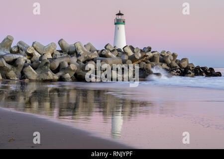 Twilight over Breakwater (Walton) Lighthouse as seen from Seabright Beach. Stock Photo