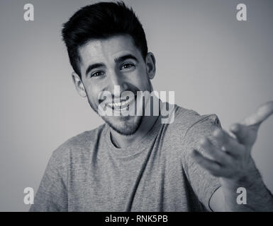 Portrait of young man celebrating achievement, a football goal, wining the lottery or having great success, shouting and gesturing in happiness and di Stock Photo