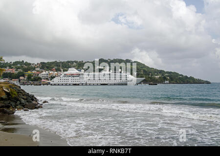 SCARBOROUGH, TRINIDAD AND TOBAGO - JANUARY 11, 2019:  View across the main bay at Scarborough with the cruise ship Silver Wind docked in the deep wate Stock Photo