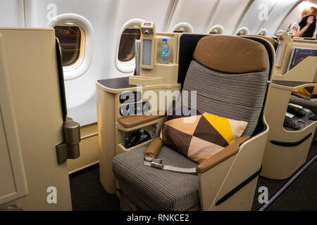 Air Travel, Etihad Airways Boeing 777-300, Business Class cabin, seat for long-haul flight Stock Photo