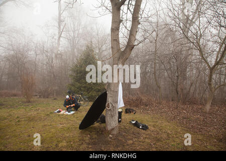 Person packing the bicycle panniers on a long cycle tour with family. A list of equipment. Stock Photo