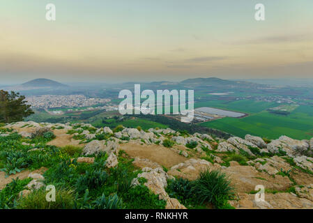 Sunset view of the Jezreel Valley and Mont Tabor, from Mount Precipice. Israel Stock Photo