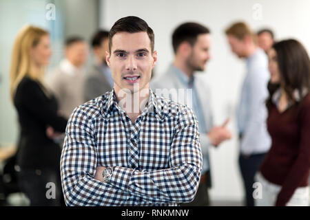Portrait of business team posing in office Stock Photo