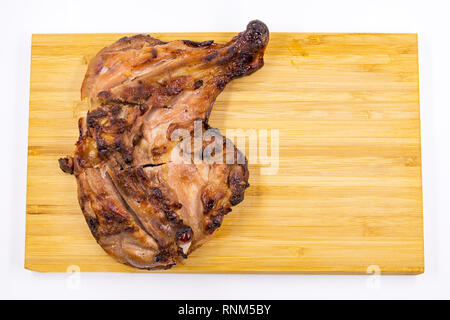Grilled chicken drumstick  and Sticky rice on wooden background Stock Photo